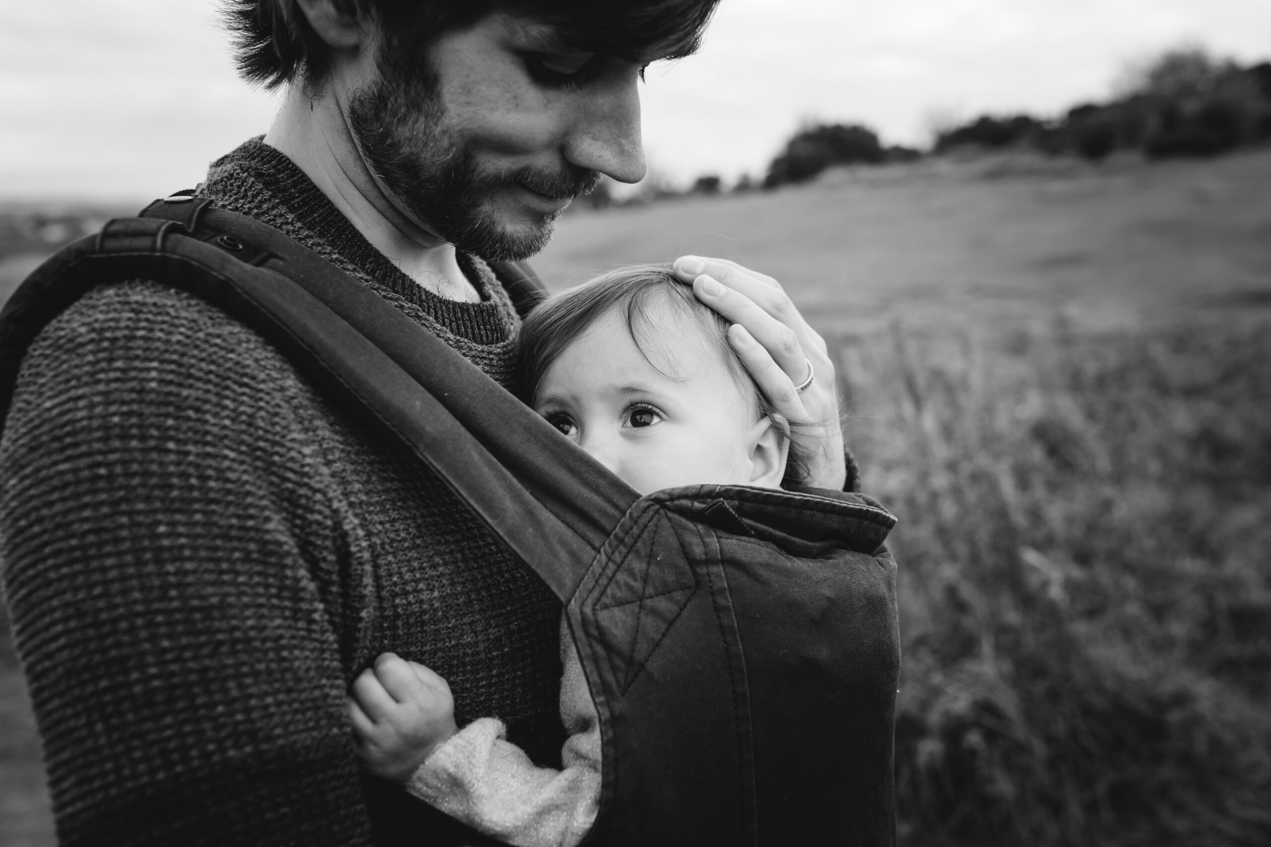 baby in carrier on dad